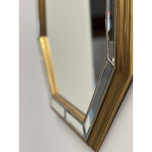 Sophisticated octagonal wall mirror designed by De Knudt, Belgium, circa 1980s.This beautifully crafted mirror features a...