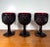 Beautiful vintage set of 3 deep ruby red pressed-glass goblets featuring an ornate raised diamond pattern and faceted...