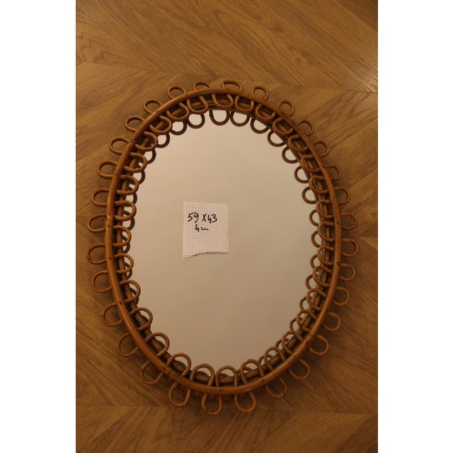 This highly decorative mirror was made in Italy in the 1960s. It is typical of the design of that period and is entirely...