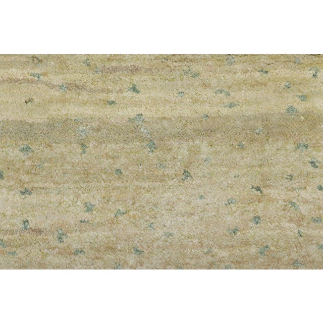 This 2x3 contemporary silk rug from India represents a refined exploration of texture and tonal abstraction. Its soft...