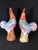 A striking pair of Antique Famille Rose Porcelain Cockerels, each standing approximately 12 inches tall. These hand-...