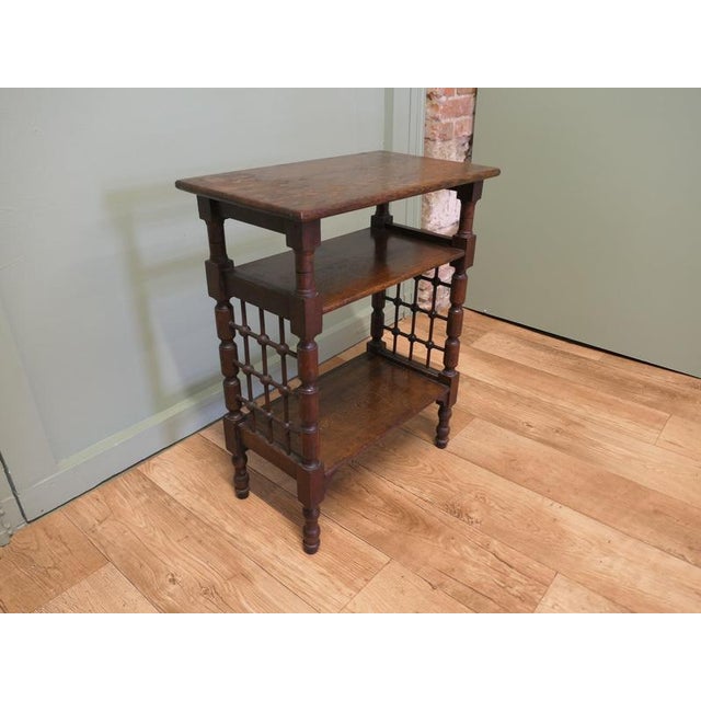 Tier Arts and Crafts Oak Side Table by Leonard Wyburd for Liberty's of London around 1885. The table stands on bobbin...