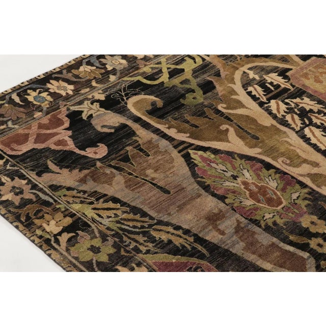This 9x12 contemporary Bidjar-inspired rug, hand-knotted in wool from India, reinterprets the grandeur of Persian floral...