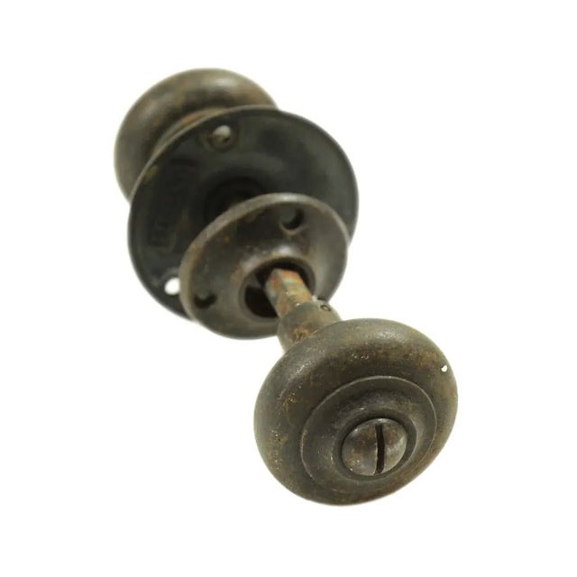 This Classic cast iron door knob set with a black finish and two sized rosettes. Good condition with surface wear from...