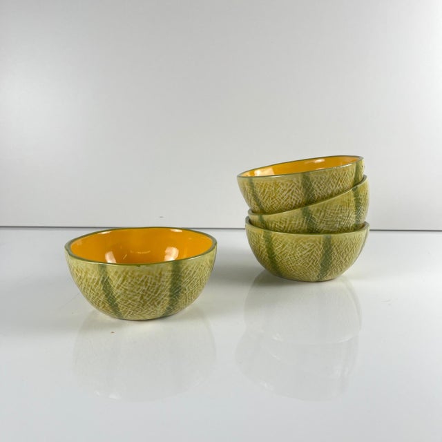 Melon service in earthenware for 4 people, 20th century Comprising one leaf-shaped platter and four half-melon-shaped...