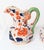 A decorative jug and basin with Imari style floral decoration in iron red and cobalt blue Large blossoms and leafy...