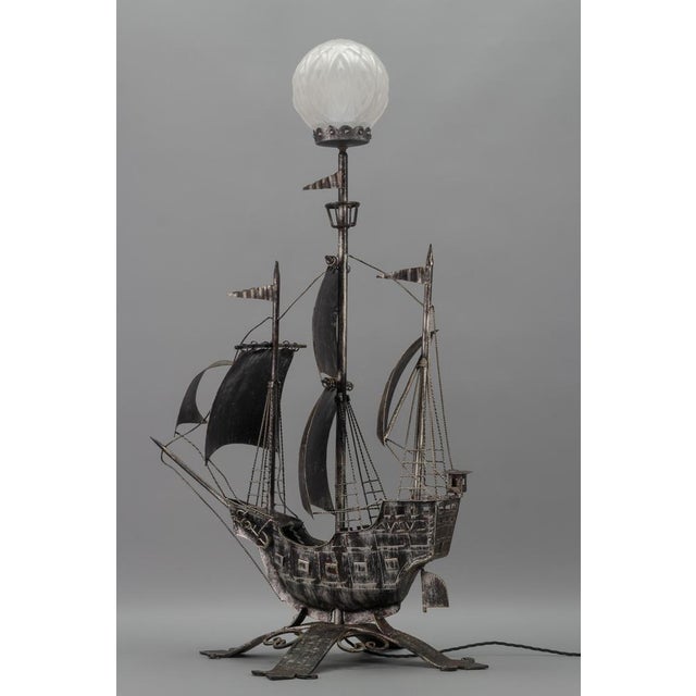 Wrought Iron and Glass Spanish Galleon Sailing Ship Shaped floor lamp, the 1950s The impressive silver-colored iron floor...
