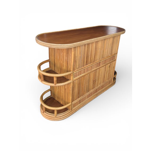 Striking vintage bamboo bar crafted in the late 1960s–1970s, showcasing beautifully spaced vertical bamboo reeds accented...