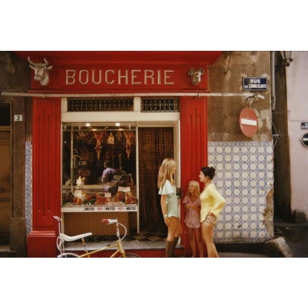 The print shows a butcher’s shop on Rue des Commercants in Saint-Tropez, on the French Riviera, August 1971. Original, C...
