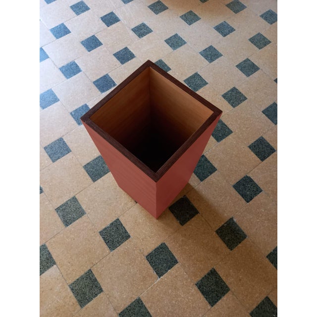 "Plinto Rosso" umbrella stand by Pietro Meccani for Meccani Design. A stunning design piece crafted from light walnut with...