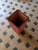 "Plinto Rosso" umbrella stand by Pietro Meccani for Meccani Design. A stunning design piece crafted from light walnut with...
