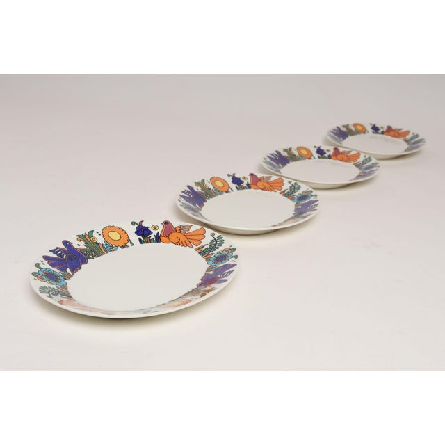 Four deep, oval porcelain plates in the vibrant, iconic "Acapulco" pattern designed in 1967 by Christiane Reuter for...