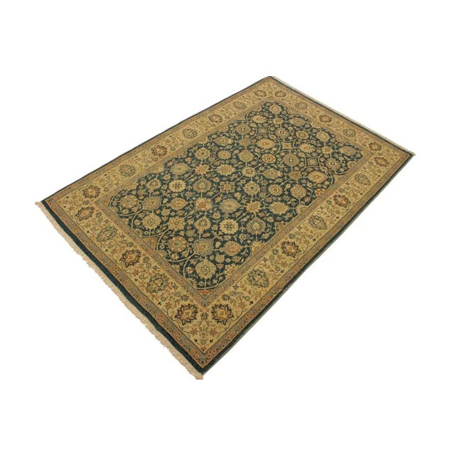 Designed with a mesmerizing intricate traditional motif this glorious hand knotted rug is a masterpiece that will fill any...