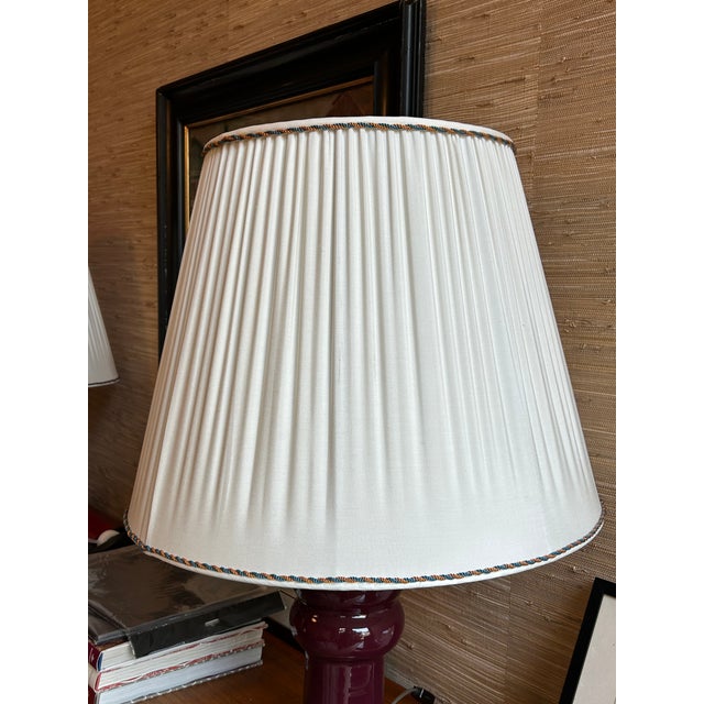 Two lampshades out of a pongee silk fabric with an orange and blue twisted silk cord on the top and bottom. Top: 13.5"...