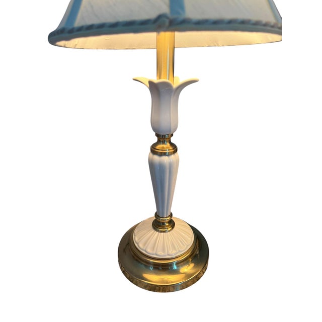 Elevate your living space with this striking pair of vintage Hollywood Regency table lamps, a celebrated mid-to-late 20th-...