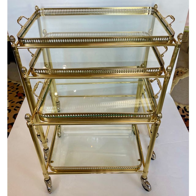 Just in, This set of three French Neoclassical style nesting bar carts, from the 20th century. Attributed to Maison...