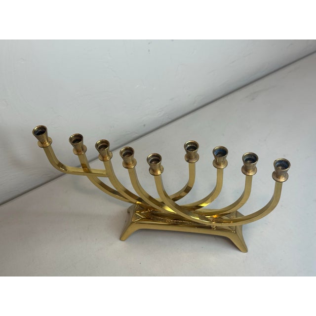 This stunning vintage mid century modern Wainberg Israel solid brass Hanukkah menorah features a beautiful 9-arm...