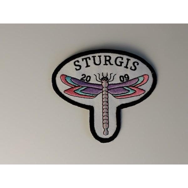 A sophisticated 12-piece assembly of motorcycle rally artifacts from 2009, capturing the peak of Y2K-era biker aesthetic....