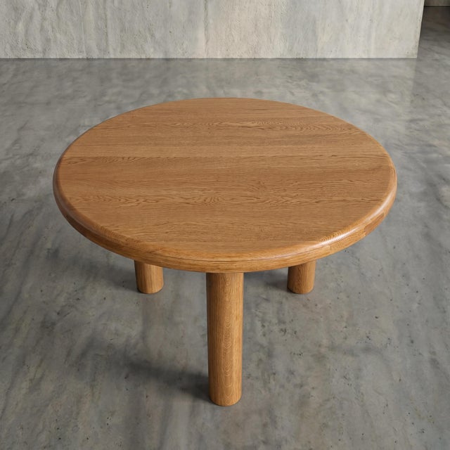 Carved from substantial cuts of solid oak, this robust dining table introduces uncompromising brutalist geometry and...