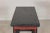 A late Qing dynasty wine table with bold architectural lines and a striking red-and-black lacquered finish. Likely...