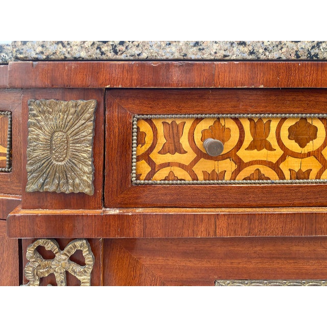Marquetry Sideboard French, Granite, Inlay, Bronze Mounts and Feet Offered for sale is a large 20th-century French design...