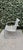 A sculptural mid-20th century modern cantilever patio lounge chair featuring a continuous metal strap seat and back with a...
