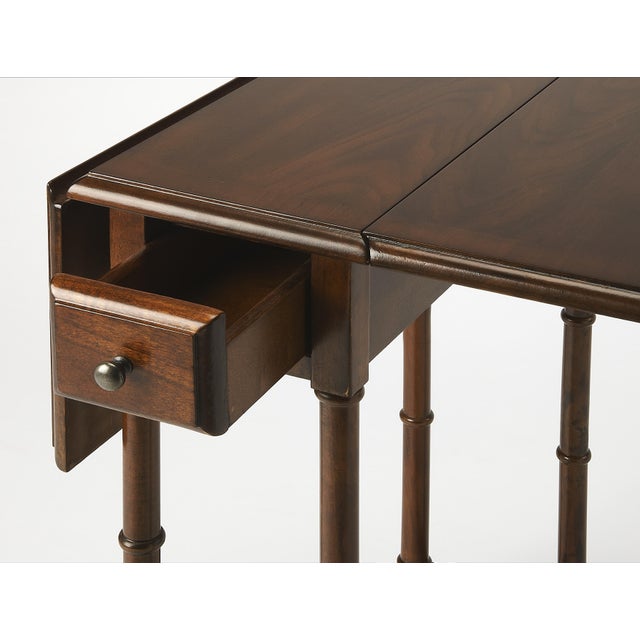 Crafted from select solid woods and veneers, the Darrow drop leaf table is both elegant and versatile. The drop leaf sides...