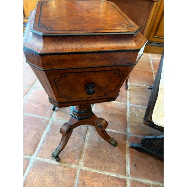 The Antique English Regency Period Amboyna Wood Tea Caddy is a stunning piece of furniture originating from the United...