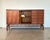 Sideboard by Ilmari Tapiovaara, made in Italy by Permanente Mobili Cantù in the 1950s. Made of teak wood, with brass and...