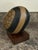 Subtle sophistication with geometric design create this skillful ceramic egg sculpture. The muted tan and black color...