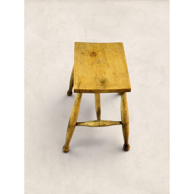 A charming 19th century English sycamore dairy stool featuring hand-turned legs and a warm honey-toned patina. Standing 18...