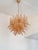 Contemporary and LUXURY vintage Mazzega style chandelier. Clear and gold “Selle ” elements in Murano glass poured over a...