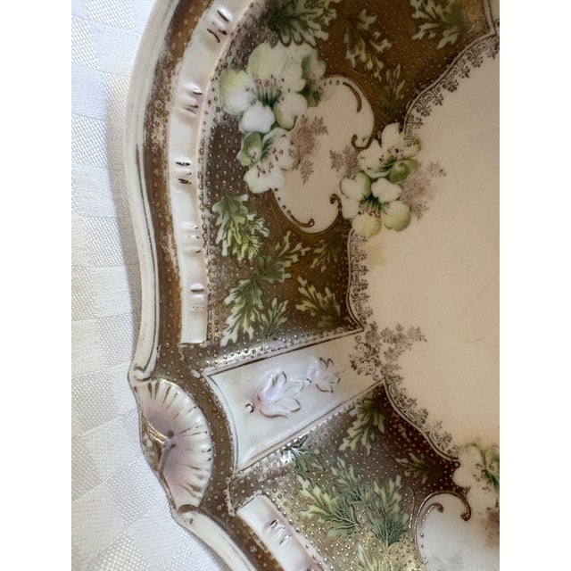 An R.S. Prussia porcelain bowl; wit a serpentine edge. R.S. Prussia is porcelain produced in Suhl, Germany in the late...