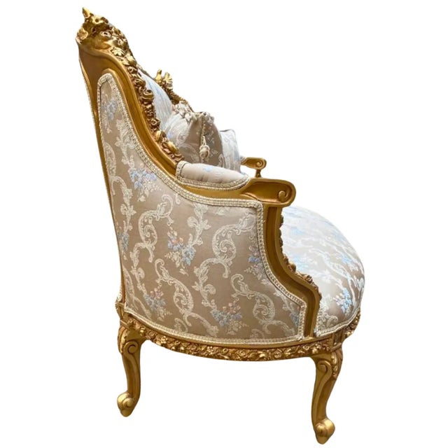 Stunning details. Beautiful sofa with gold details and beige upholstery. Fully refinished in new gold and padding. We...