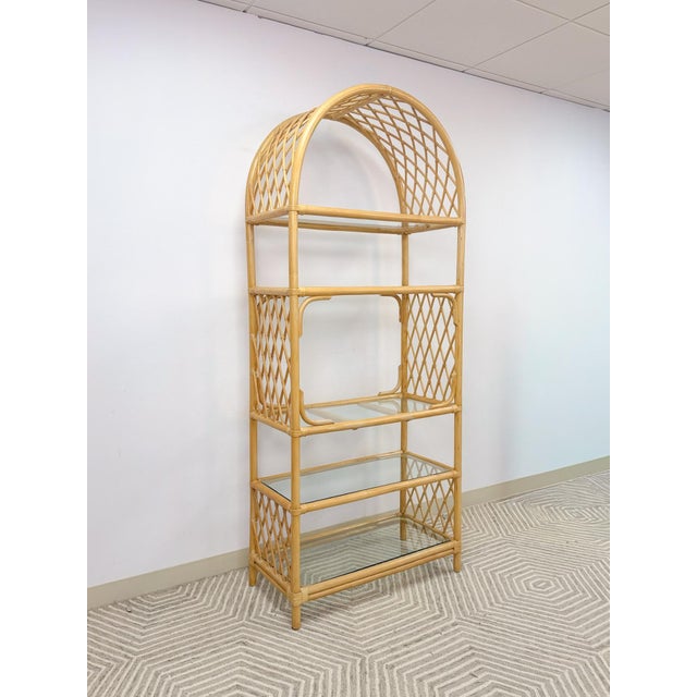 This gorgeous vintage arched rattan and wicker bamboo shelf is a stunning natural statement piece. Five glass shelves sit...