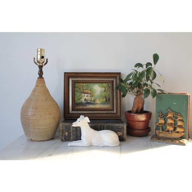 1970's textured beige studio art pottery table lamp. Signed by artist on bottom. Dated 1978. Does not include harp or...