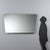 This rectangular wall mirror, made in the 1960s with rounded corners, is typical of mid-century modernism. The thin,...