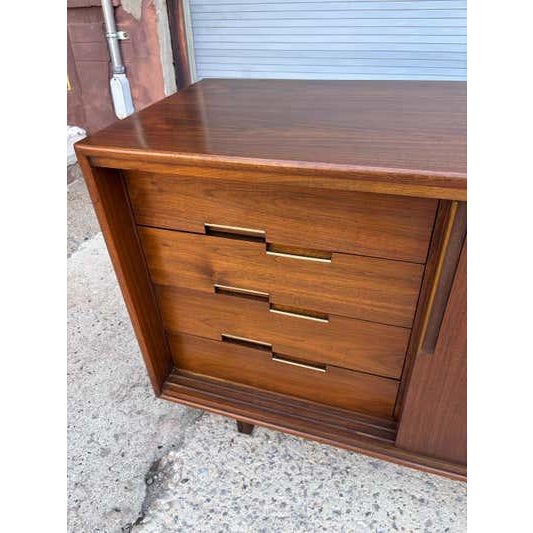Cavalier Low Dresser/ Credenza. 3 sliding doors move easily across the front of this cabinet, revealing 3 pull out drawers...