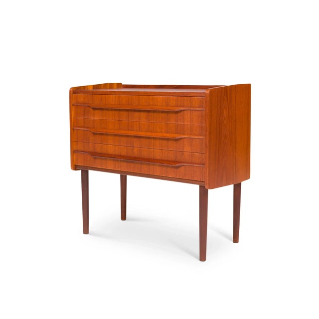 A vintage Danish teak chest with a beautiful teak grain. This small chest is a perfect size to be used as an accent or...