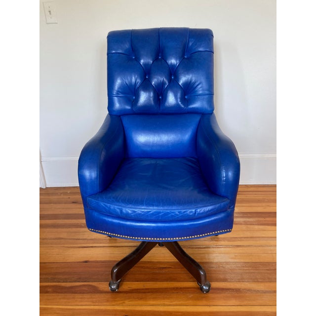 Incredibly lovely and hard to find vibrant blue leather desk chair. It swivels 360 degrees and moves up and down. Larger,...