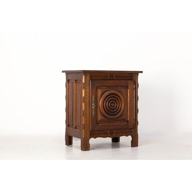 Small French cabinet sideboard or Little buffet in carved oak, Charles Dudouyt style, 1960s Small French storage cabinet...