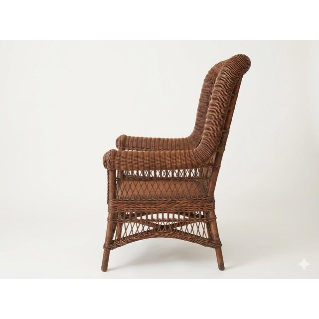 An exceptional, highly collectible find for enthusiasts of fine American craftsmanship, this Antique Wicker and Rattan...