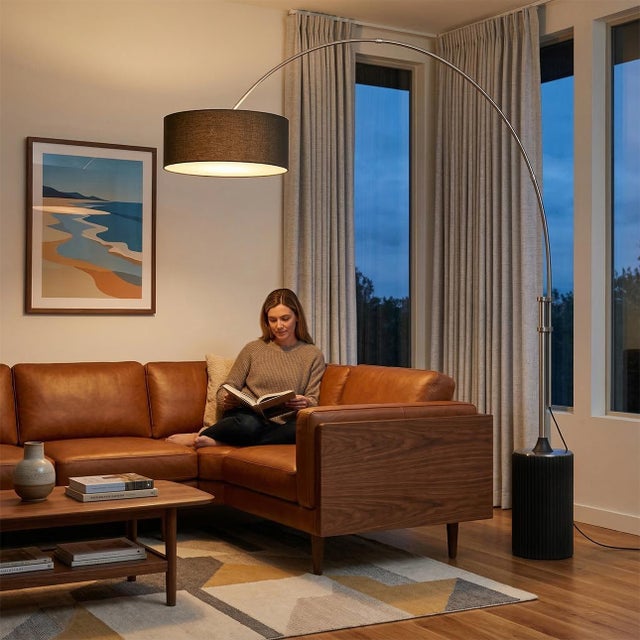 The Tambo Arc Lamp is a striking Mid-Century Modern lighting piece designed by Peter Morelli in 1984. Its sweeping arc...