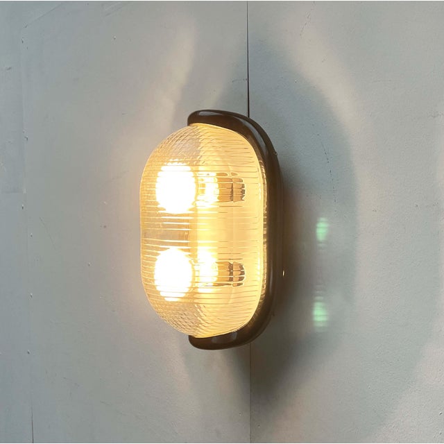 Wall lamp by the Italian manufacturer Flos, designed by Achille Castiglioni in the early 1970s. In Italian, "Noce" means...