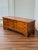 This rare chest is as versatile as it is storied, serving as storage, a coffee table, or a bench, while carrying with it a...