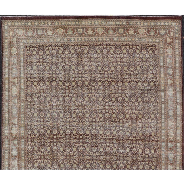 Measures: 6'4 x 9'10 Persian Tabriz Antique Rug in Herati Design In Dark Arginine, Blue, and Tan. Keivan Woven Arts / rug...