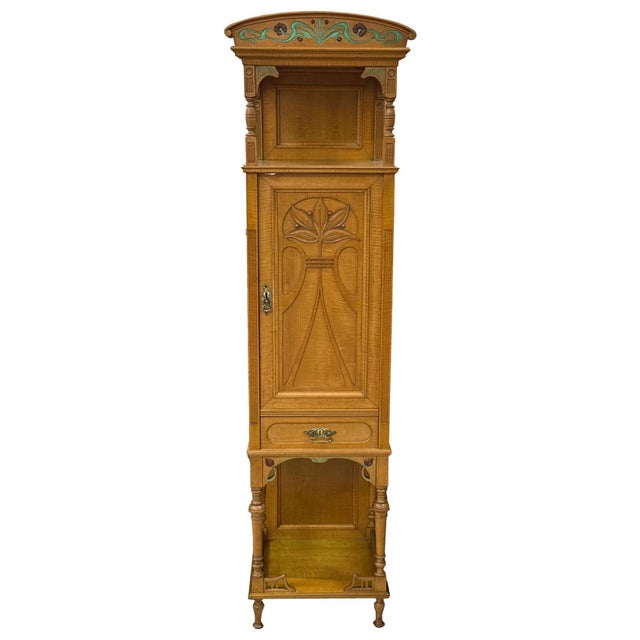 An Art Nouveau cabinet / vertico dating from circa 1900–1910, distinguished by its refined decorative character and...