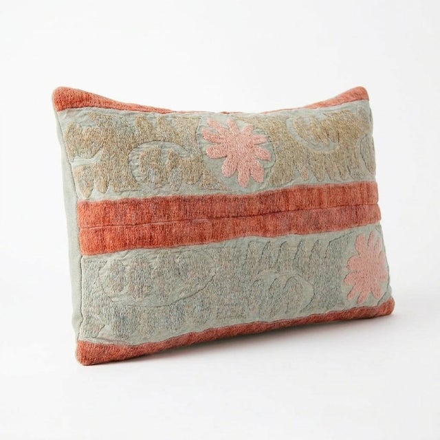 This beautiful 13'' x 22'' hand-embroidered Suzani pillow cover was made from authentic Uzbek cotton fabric. The intricate...