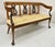 Vintage Italian Neoclassical Cherry Wood Dolphin Lyre Carved Rush Seat Bench. Item features solid carved wood frame,...