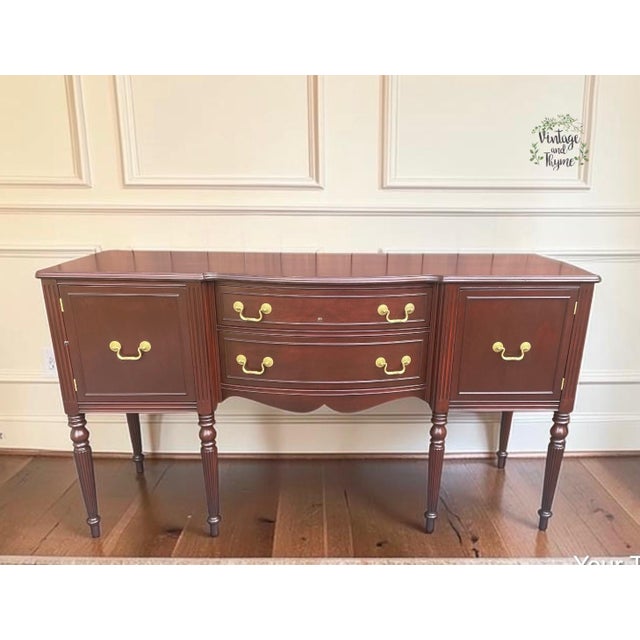 Add timeless elegance and classic craftsmanship to your home with this beautiful vintage mahogany Hepplewhite style buffet...